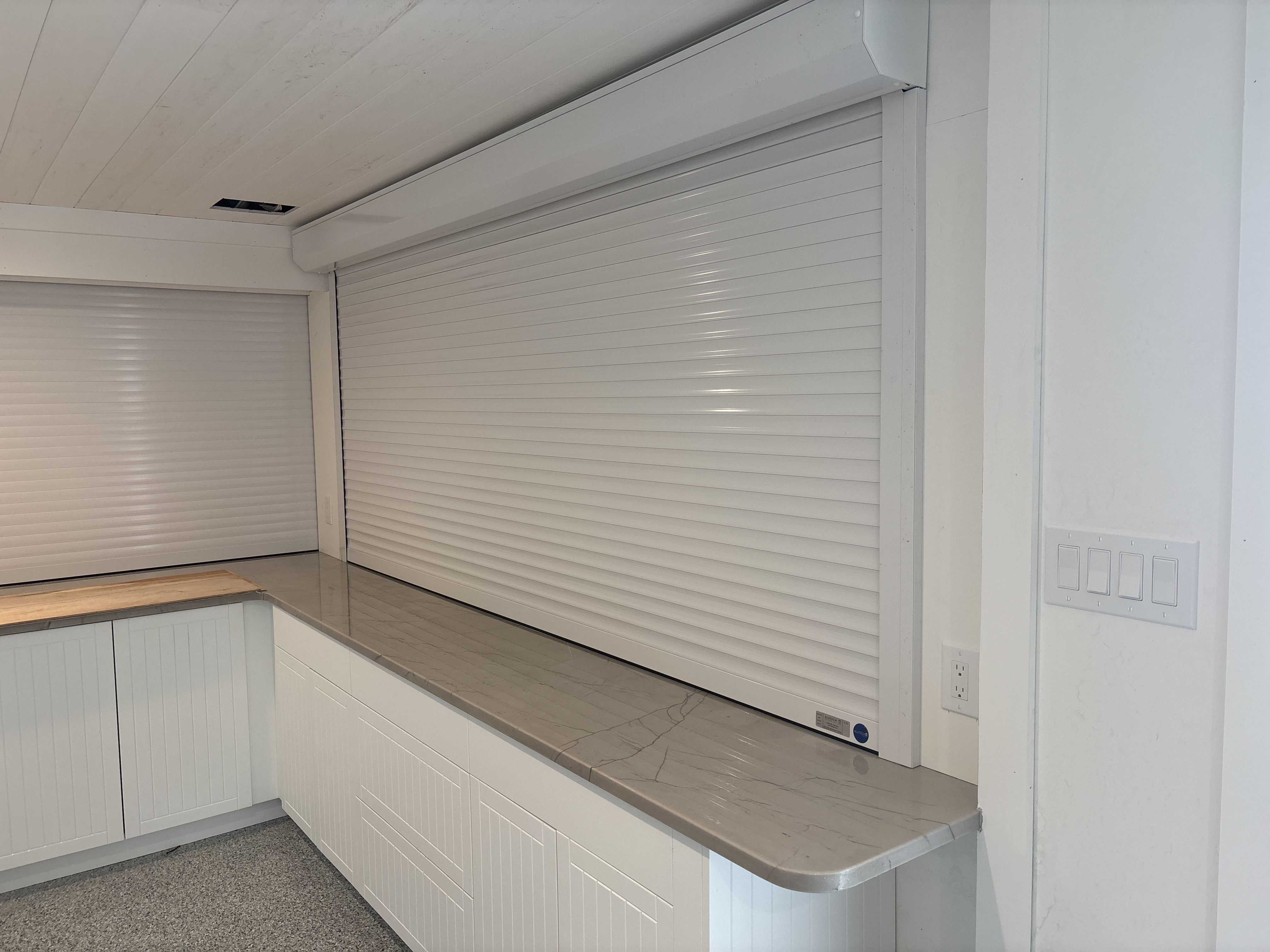 Accordion hurricane shutters